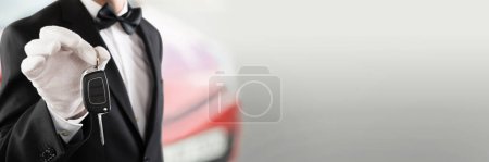 Photo for Valet Car Parking Chauffeur Person Holding Key - Royalty Free Image