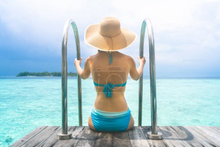 Photo for Rich Woman Summer Vacation Lifestyle. Female Body In Sunhat - Royalty Free Image