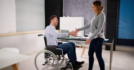 Photo for Business Person In Wheel Chair Shaking hands - Royalty Free Image
