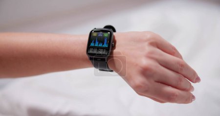 Photo for Smart Watch Showing Heartbeat Monitor On Woman's Hand - Royalty Free Image