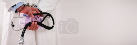 Photo for Medical Malpractice And Medicine Fraud. Healthcare Physician In Handcuffs - Royalty Free Image