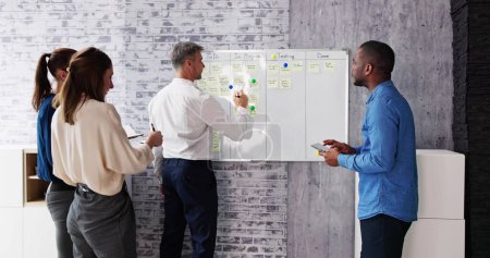 Photo for Agile Business Team Using Kanban Task Board - Royalty Free Image