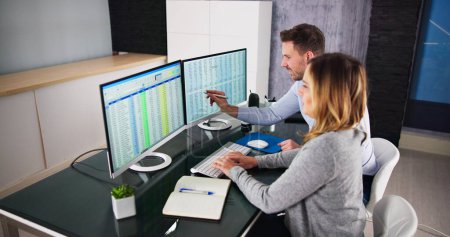 Photo for Analyst Employee Working On Spreadsheet Using Desktop Computer - Royalty Free Image
