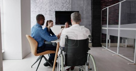 Foto de Diverse Group Business People Including Man With Disability - Imagen libre de derechos