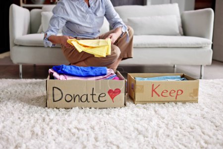 Photo for Donating Decluttering And Cleaning Up Wardrobe Clothes - Royalty Free Image