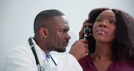 Photo for Otolaryngology Ear Check Using Otoscope. Doctor Examining Patient - Royalty Free Image