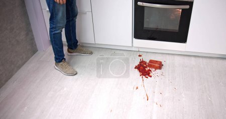 Photo for Dirty Floor With Spilled Food In Kitchen - Royalty Free Image