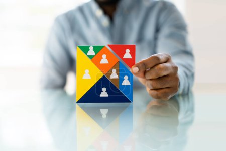 Photo for HR Recruitment Hand Making Tangram Puzzle. Talent Management - Royalty Free Image