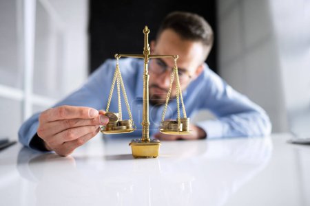 Photo for Money On Justice Scale. Lawyer Balancing Wealth - Royalty Free Image