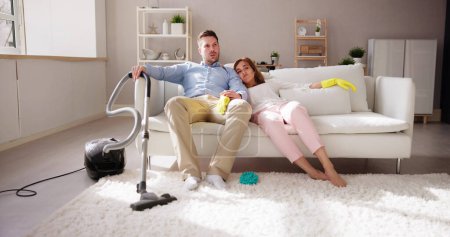 Photo for Bored Family After Cleaning House Room- Exhausted Couple - Royalty Free Image