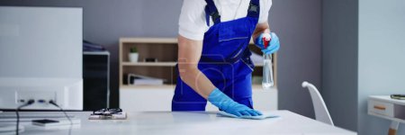 Photo for Professional Workplace Janitor Service. Office Desk Cleaning - Royalty Free Image