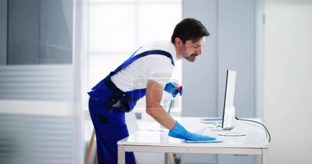 Photo for Professional Workplace Janitor Service. Office Desk Cleaning - Royalty Free Image