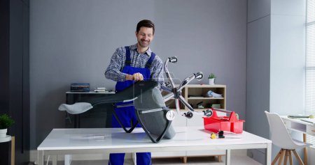 Photo for Office Chair Assembling And Repair. Man Working With Tool - Royalty Free Image