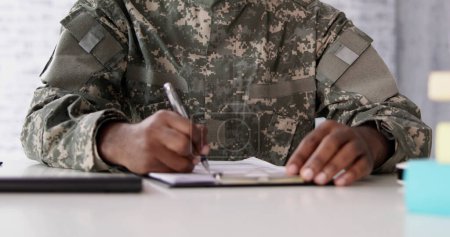 Foto de Military Student Education. Army Soldier Veteran In College - Imagen libre de derechos