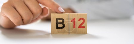 Photo for Vitamin B12. Medical Doctor Hand In Hospital - Royalty Free Image