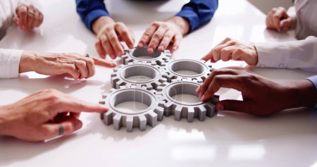 Photo for Diverse People Hands Holding Gear Wheels. Business Partnership - Royalty Free Image