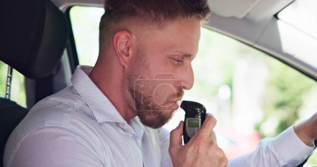 Breathalyzer Alcohol Test In Car. Man Taking Breath Test