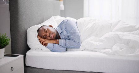 Photo for African American Man With Sleep Apnea Snoring - Royalty Free Image