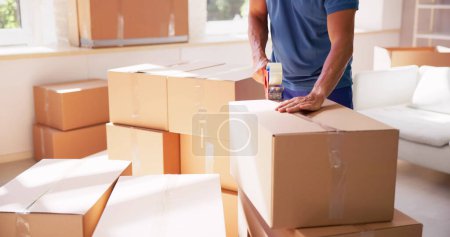 Photo for Mover Service Packing Box. Moving Delivery In House - Royalty Free Image