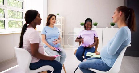 Photo for Pregnant Expecting Women Group Class. Pregnancy And Maternity - Royalty Free Image