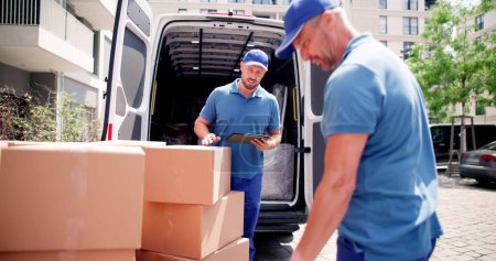 Photo for Mover Workers Near House Relocation Van. Professional Delivery - Royalty Free Image