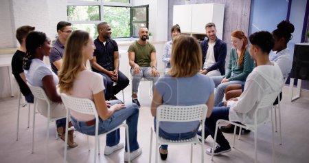 Photo for Young Multiracial Millennial Friends Sitting In Circle Having Group Discussion - Royalty Free Image