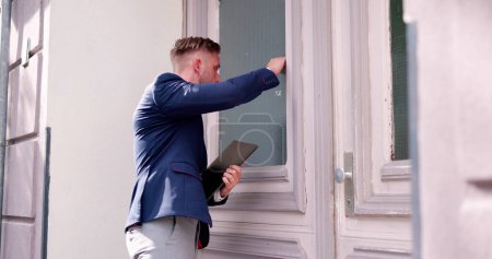 Photo for Bailiff Debt Collector Man Knocking Front Door - Royalty Free Image