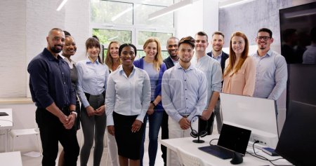 Photo for Happy Group Of Business People Standing In Office - Royalty Free Image