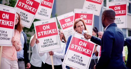 Photo for Workers Strike Demonstration In City. Labor Union March. Protest Rally - Royalty Free Image