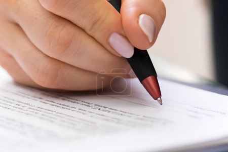 Photo for Signing Business Contract Document And Paper In Lawyer Office - Royalty Free Image
