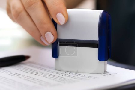 Photo for Record Or Permit Document Paper Stamper In Office - Royalty Free Image
