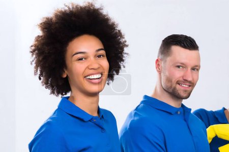 Photo for Portrait Of Happy Male And Female Janitors With Cleaning Equipment - Royalty Free Image