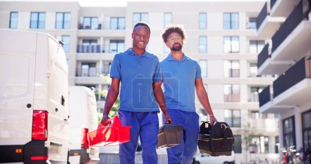 Photo for Confident Technicians Walking New Truck On Street - Royalty Free Image