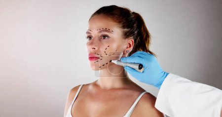Photo for Facial Aesthetics Facelift. Plastic Surgery Drawings On Face - Royalty Free Image