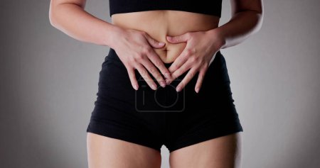 Photo for PMS Menopause Symptoms. Girl Tummy Stomach Pain - Royalty Free Image