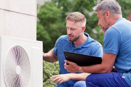 Commercial HVAC Technician Installing AC Air Conditioner