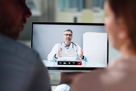 Photo for Pregnant Couple In Online Video Conference Call With Doctor - Royalty Free Image