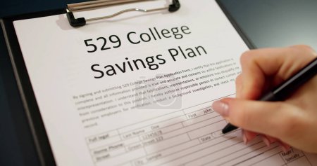 Photo for 529 College Savings Plan Form On Desk - Royalty Free Image