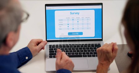 Photo for Filling Customer Survey Online Electronic Form On Laptop Screen - Royalty Free Image