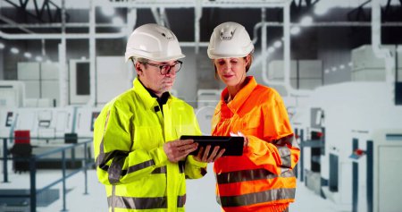 Factory Worker Osha Inspection Using Tablet Computer