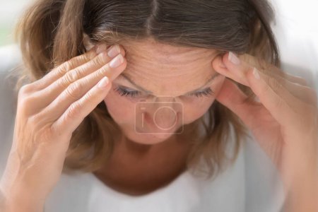 Man with BPPV experiencing dizzy vertigo pressure headache