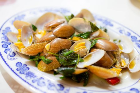 Photo for Pan fry clam with basil in Taiwanese seafood store - Royalty Free Image