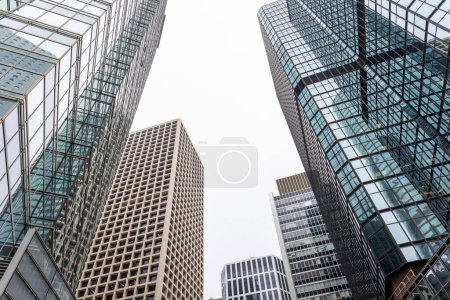 Photo for Looking up at towering skyscrapers - Royalty Free Image