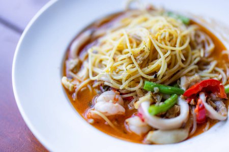 Téléchargez les photos : Pasta with seafood dish in restaurant - en image libre de droit