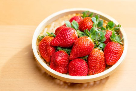 Photo for Ripe and luscious strawberries in a basket - Royalty Free Image