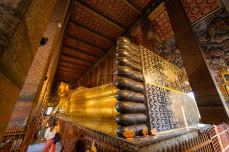 Photo for Bangkok, Thailand - 10 March 2020: Reclining Buddha figure in Wat Pho Buddhist temple - Royalty Free Image