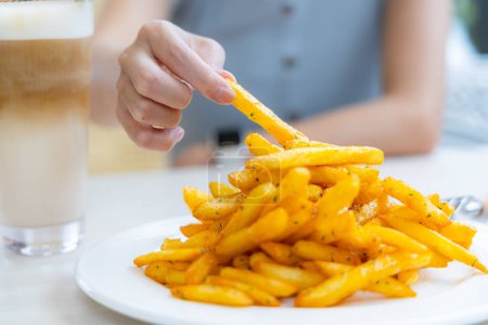 Photo for Eat French fries with cheese - Royalty Free Image