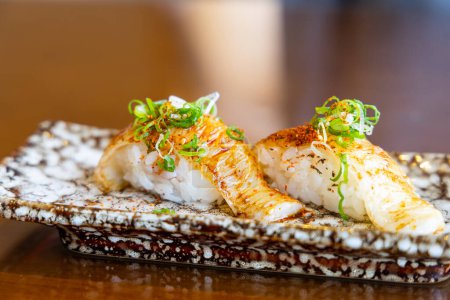 Photo for Fresh grill flounders sushi in Japanese restaurant - Royalty Free Image