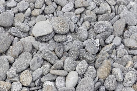 Téléchargez les photos : Fond de galets de pierre sur la plage - en image libre de droit