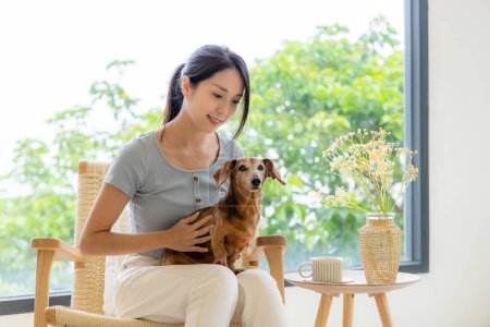 Photo for Woman go to coffee shop with her dog - Royalty Free Image
